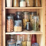 reusable-glass-jars-on-pantry-shelf-in-kitchen-2022-11-09-04-52-09-utc